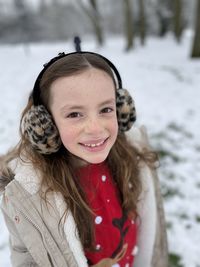 Portrait of cute smiling girl during winter