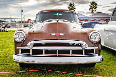 View of vintage car against cloudy sky