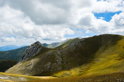 Scenic view of mountains against sky in montemonaco, marche italy 