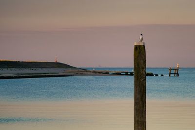 Scenic view of sea against sky at sunset