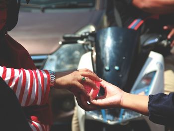 Close-up of people holding hands