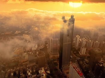 Cityscape against sky at sunset