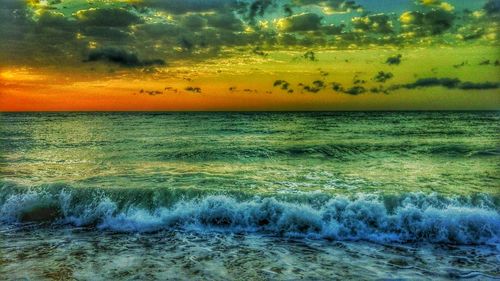 Scenic view of sea against dramatic sky