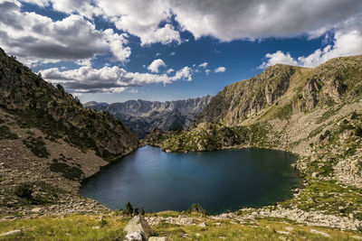 Scenic view of lake and mountains against sky