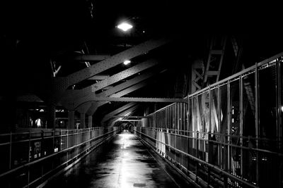 Illuminated bridge at night