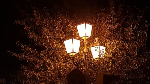 Low angle view of illuminated lantern at night