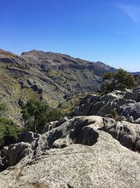 Scenic view of rocky mountains against clear sky