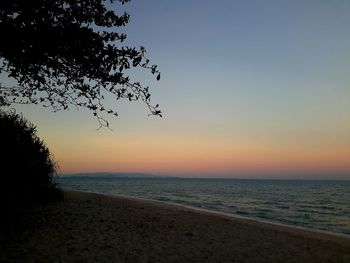 Scenic view of sea against clear sky during sunset