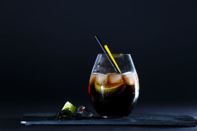 Close-up of glass against black background