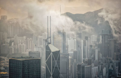 Aerial view over foggy hong kong city