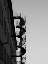 Low angle view of spiral staircase of building against clear sky