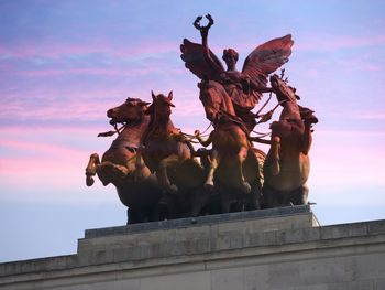 Low angle view of statue against sky