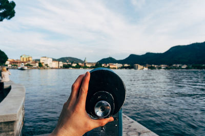 Coin-operated binoculars against como lake
