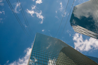 Low angle view of building against cloudy sky