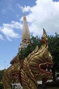 Statue of temple against building