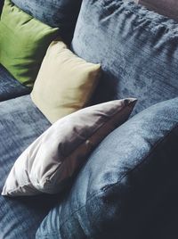 Low section of man relaxing on sofa