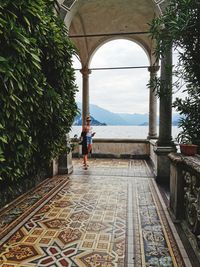 Rear view of people walking on walkway