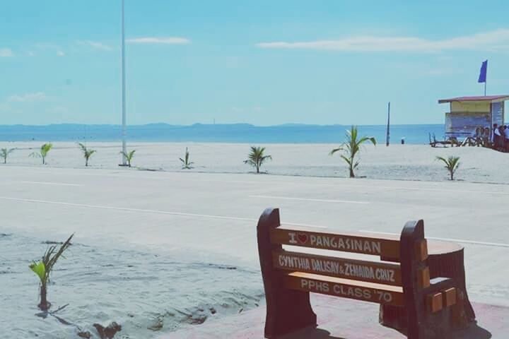 VIEW OF BEACH IN FRONT OF SEA AGAINST SKY