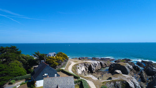 Scenic view of sea against clear blue sky