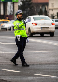 Full length of man standing on road