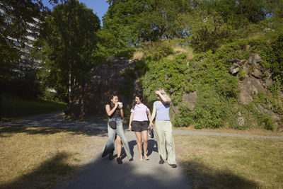 Young female friends standing and talking together