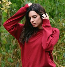 Portrait of beautiful young woman standing outdoors