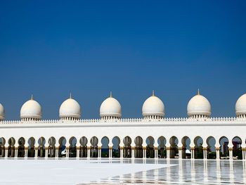 Mosque against clear blue sky