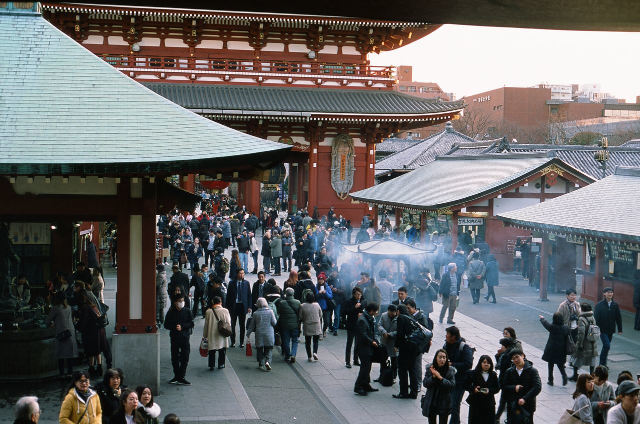 large group of people, crowd, built structure, architecture, building exterior, crowded, roof, real people, men, women, travel destinations, outdoors, day, people, adult