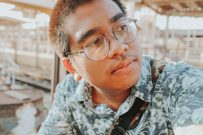 Close-up portrait of young man with eyeglasses