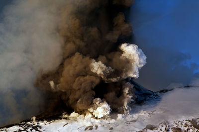 Smoke emitting from volcanic mountain