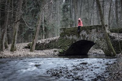 Man cycling in forest