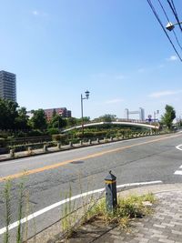 Street by road against clear sky