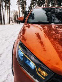 Close-up of snow covered car