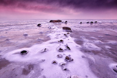 Scenic view of sea against sky during sunset