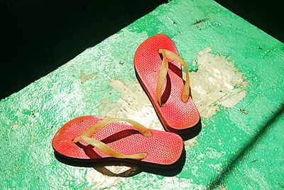 Close-up of shoes on tiled floor