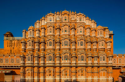 Low angle view of building against blue sky