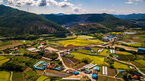 High angle view of houses and mountains against sky