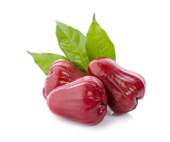 Close-up of strawberry over white background