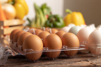 Close-up of eggs in container on table