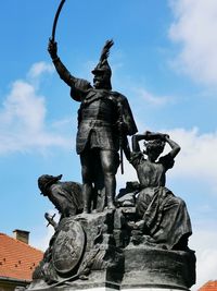 Low angle view of statue against sky