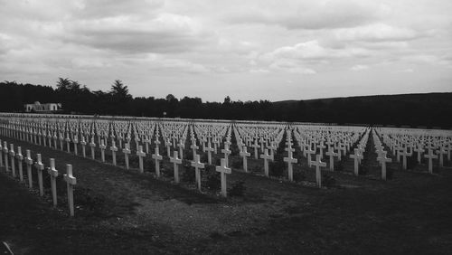 Row of cemetery against sky