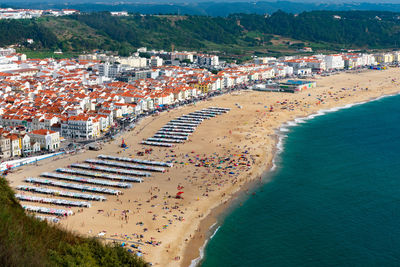 High angle view of sea and buildings in city