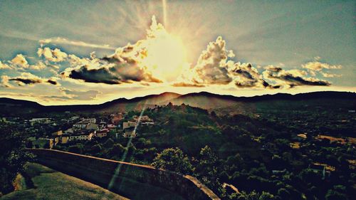 Scenic view of mountains against cloudy sky