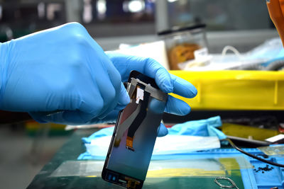 Close-up of person holding umbrella