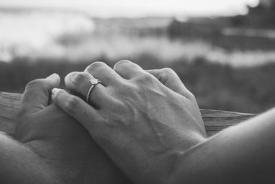 Close-up of couple holding hands