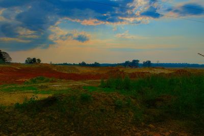 Scenic view of field against sky during sunset