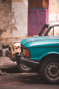 Vintage car parked on street in city