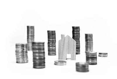 Close-up of coins over white background