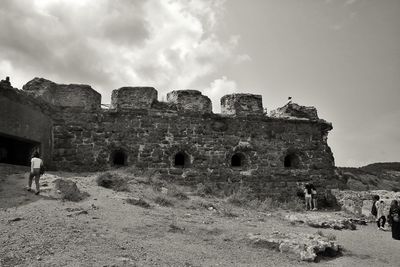 Old ruin building against cloudy sky