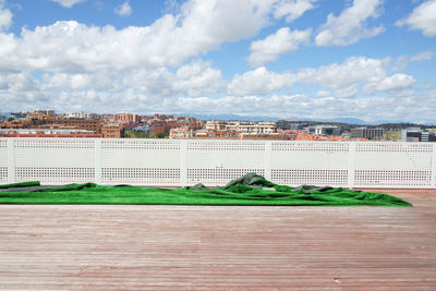 Green carpet on building terrace in city